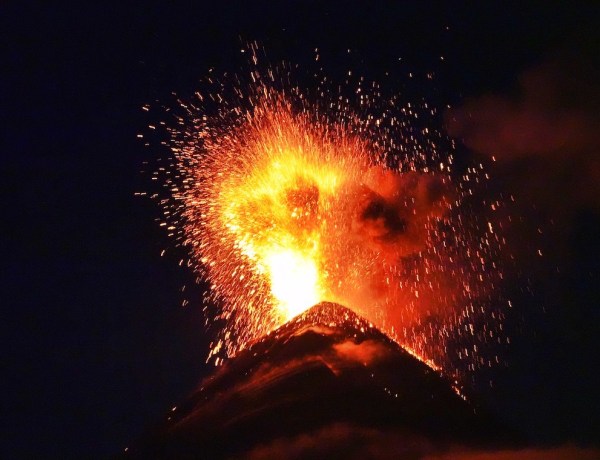 Volcano de Fuego erupting and spewing lava at night