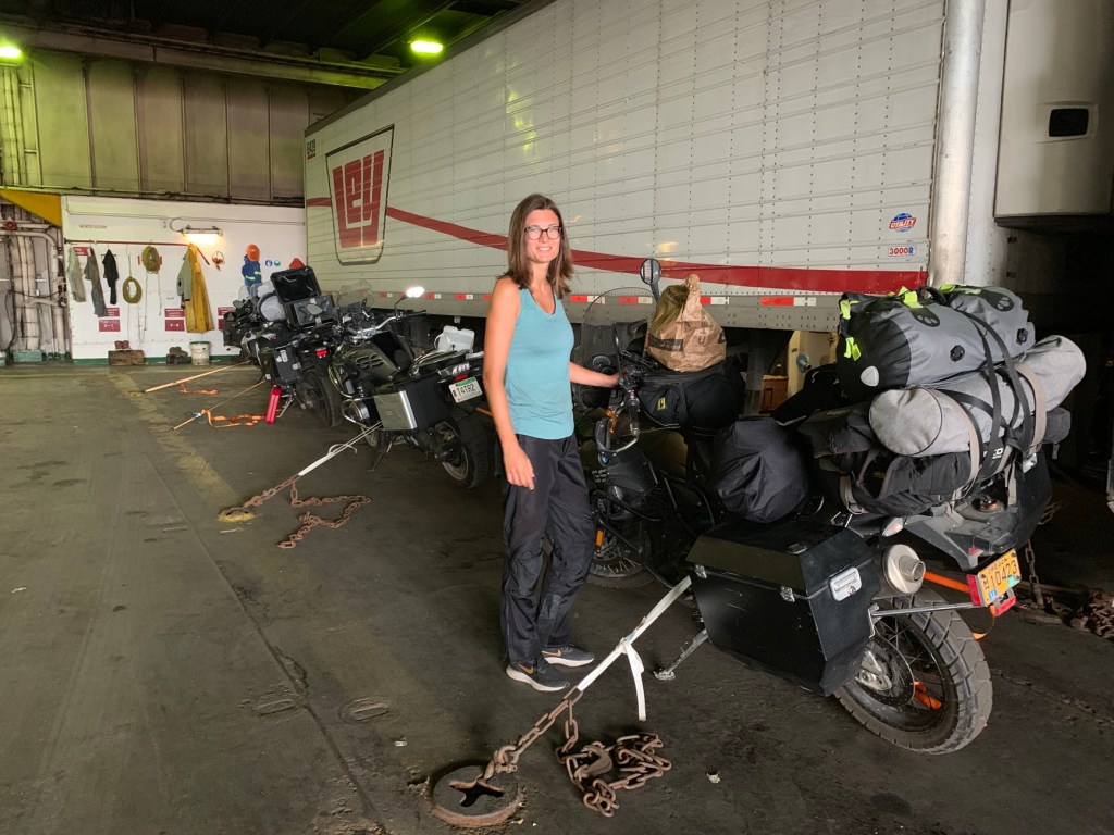 Woman standing in the ferry, next to the secured ADV motorbike ready to cross La Pas to Mazatlan Ferry