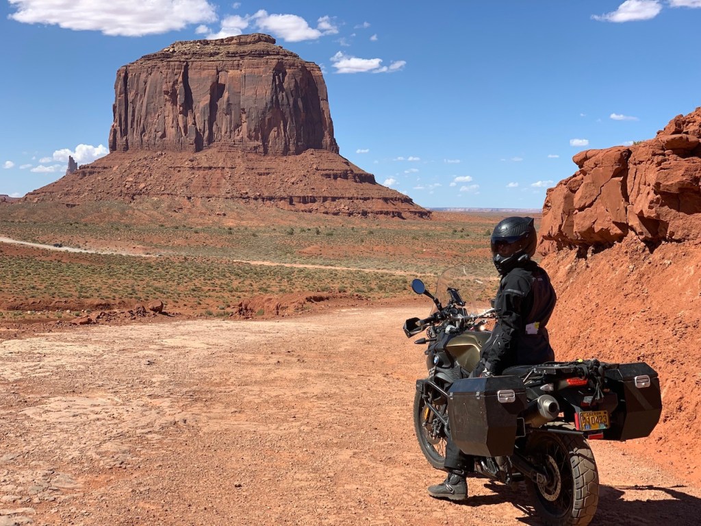 Fully geared Adventure Rider overlooking Monument Valley