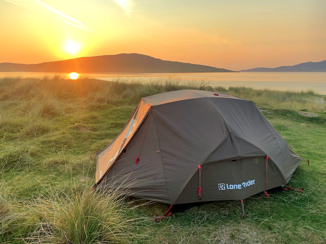 Lone Rider ADV motorcycle tent pitched on Luskentyre beach during sunset